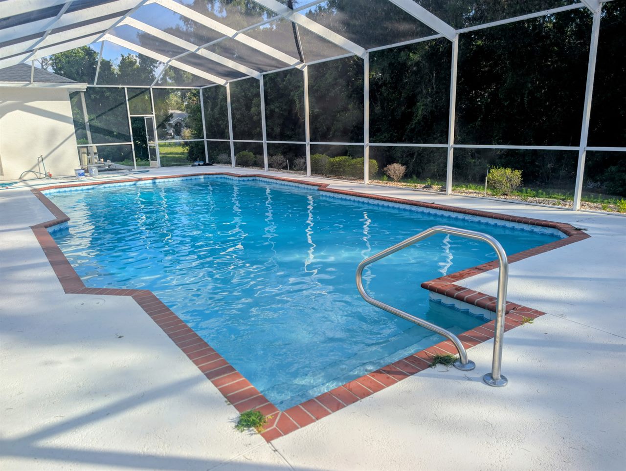 Same pool after — sparkling clear water